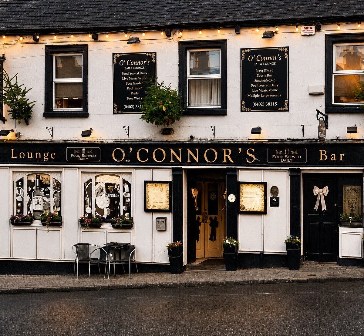 O'Connor's Bar, Tinahely village — black and gold facade with string lights